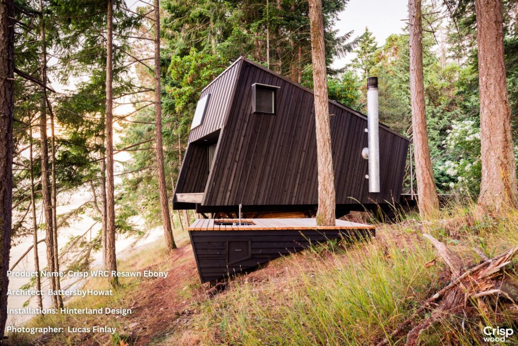 Modern cabin featuring Crisp WRC Resawn Ebony prefinished siding, installed in BC forest by Hinterland Design, architecture by Batters by Howat.