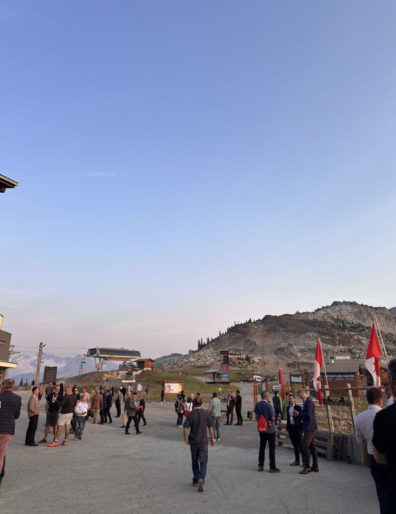 Business professionals networking at Global Buyers Mission in Whistler with mountain backdrop