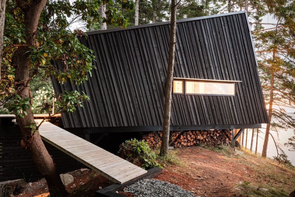 Dark board and batten cabin in the forest