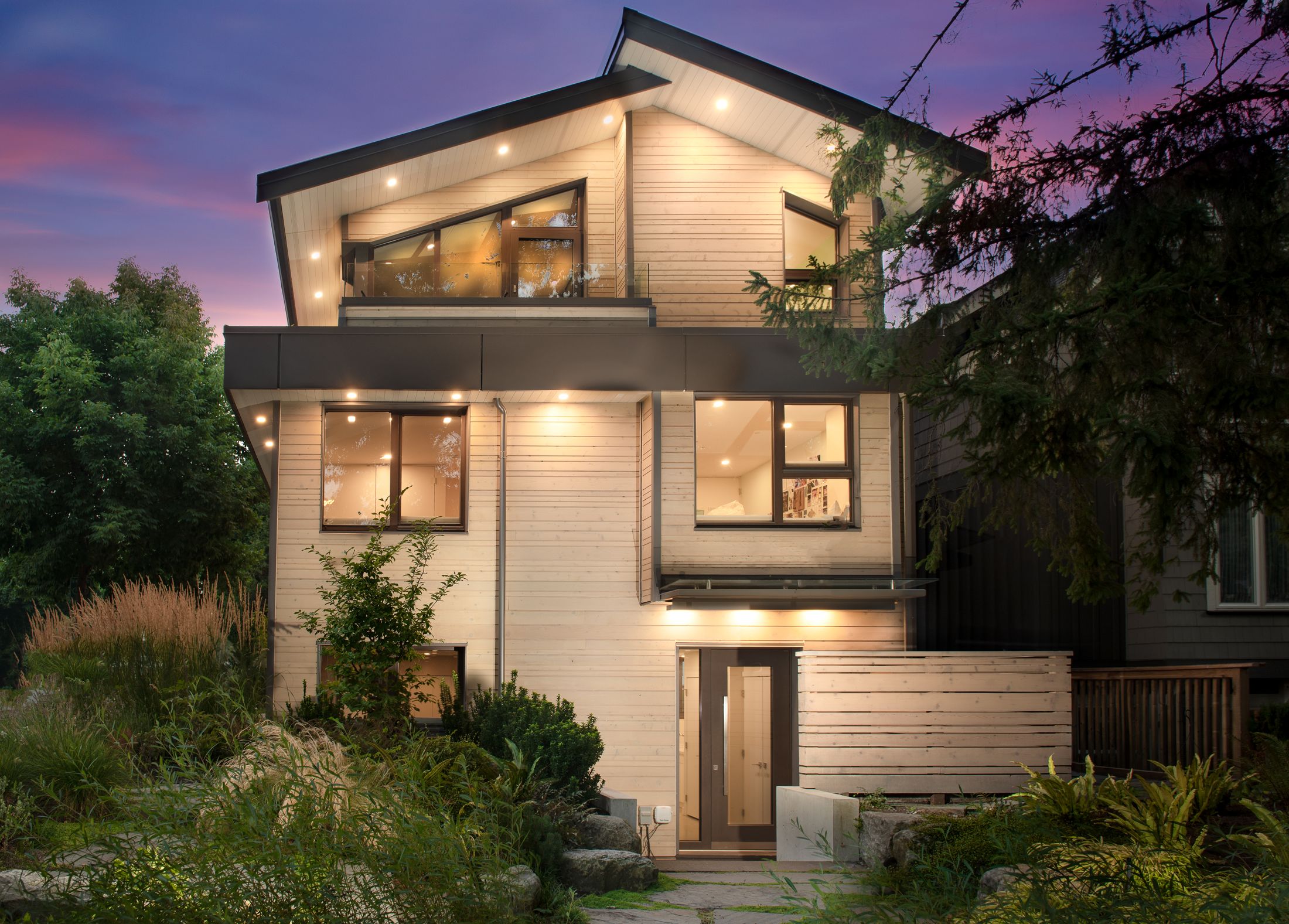 Wood-clad home at dusk