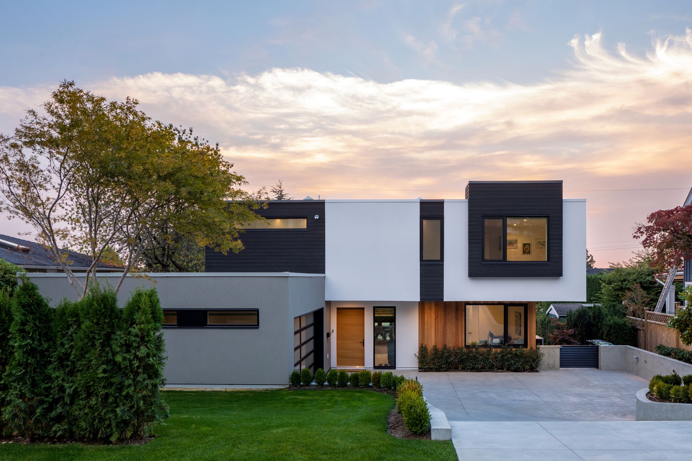 Modern home with wood cladding at sunset