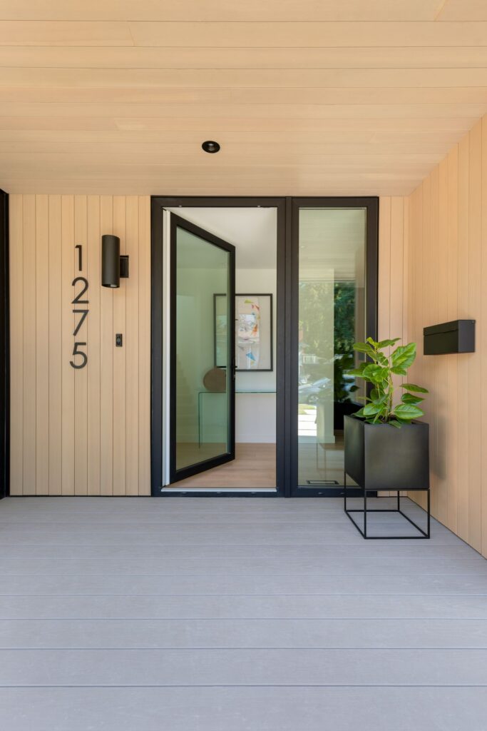 Vertical wood cladding and ceiling at a front entry