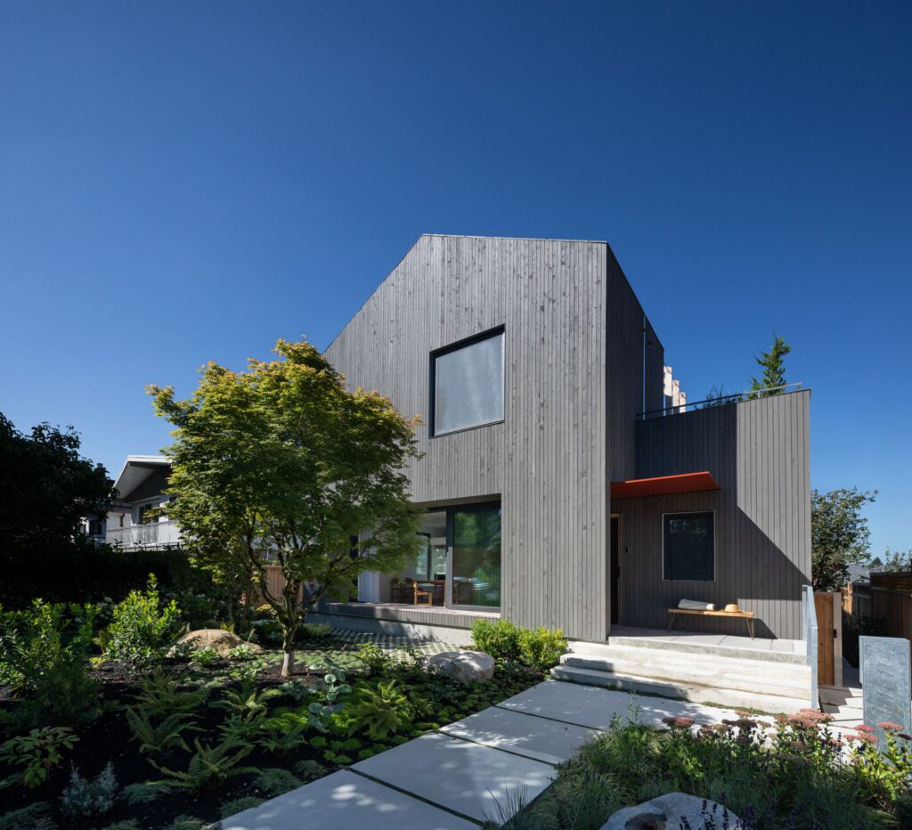 Grey vertical wood cladding on a modern home