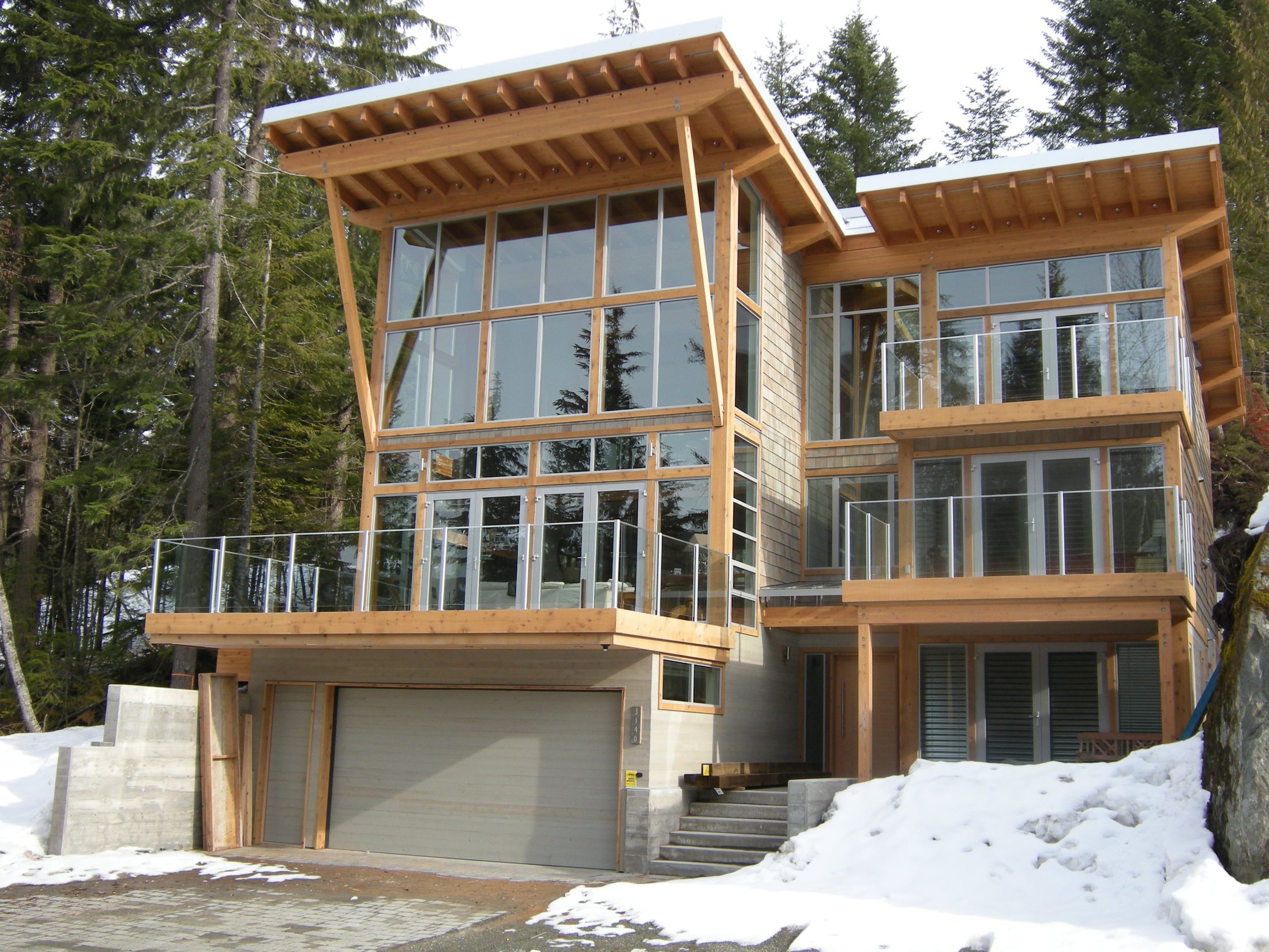 Timber frame home with wood soffits in winter